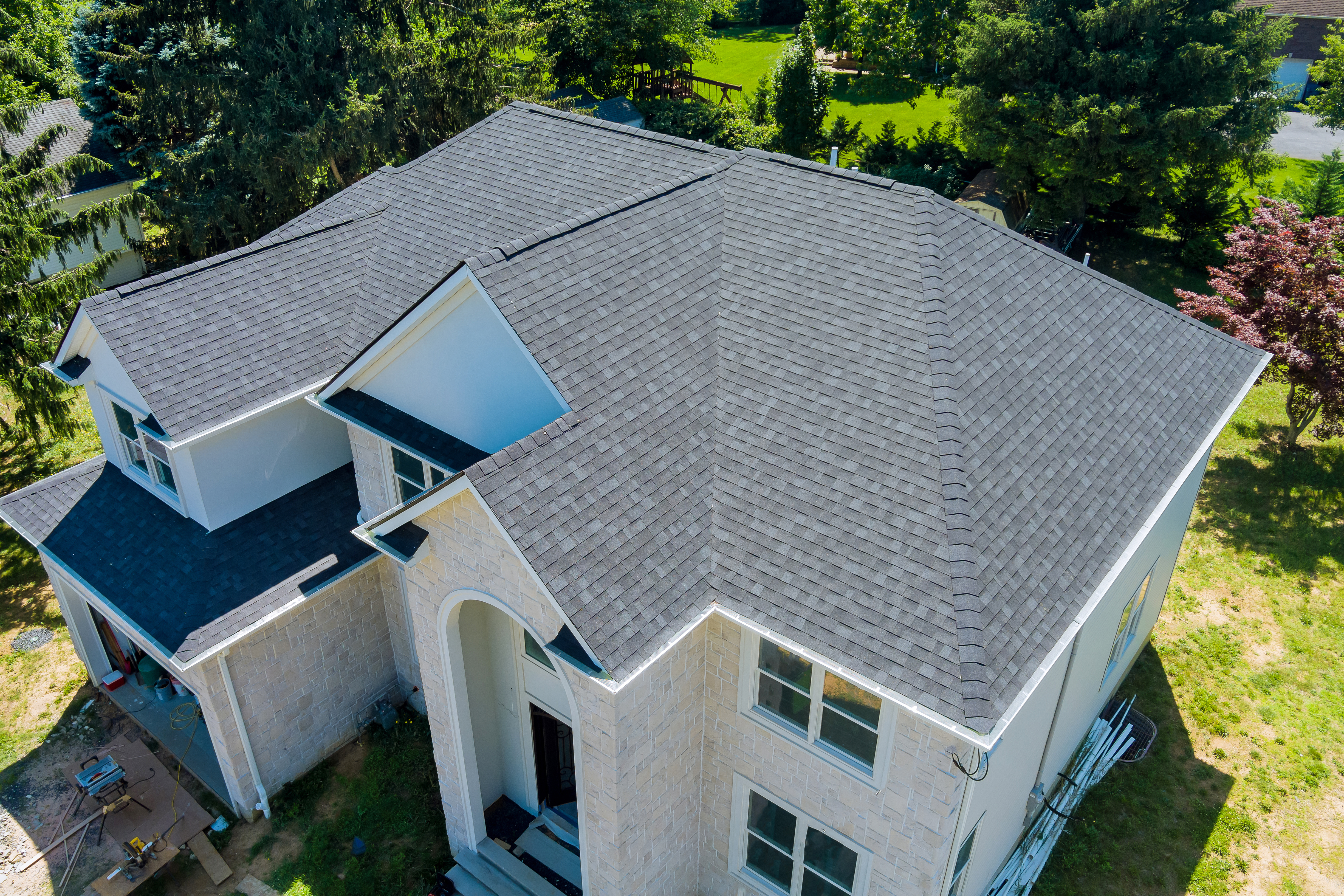 Aerial view of completed residential roof with asphalt shingles in Connecticut